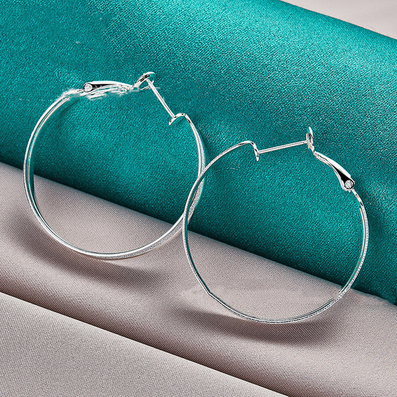 "Elegant Silver Glitter Hoop Earrings – Timeless Sparkle for Effortless Glam"