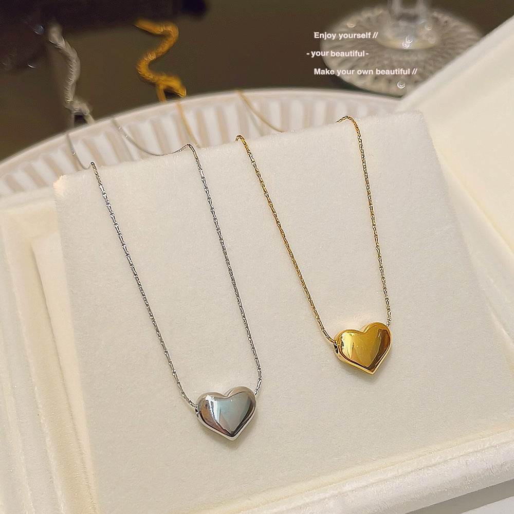 "Golden Love Sweater Chain – Light Luxury Heart Pendant Necklace with Minimalist Design"