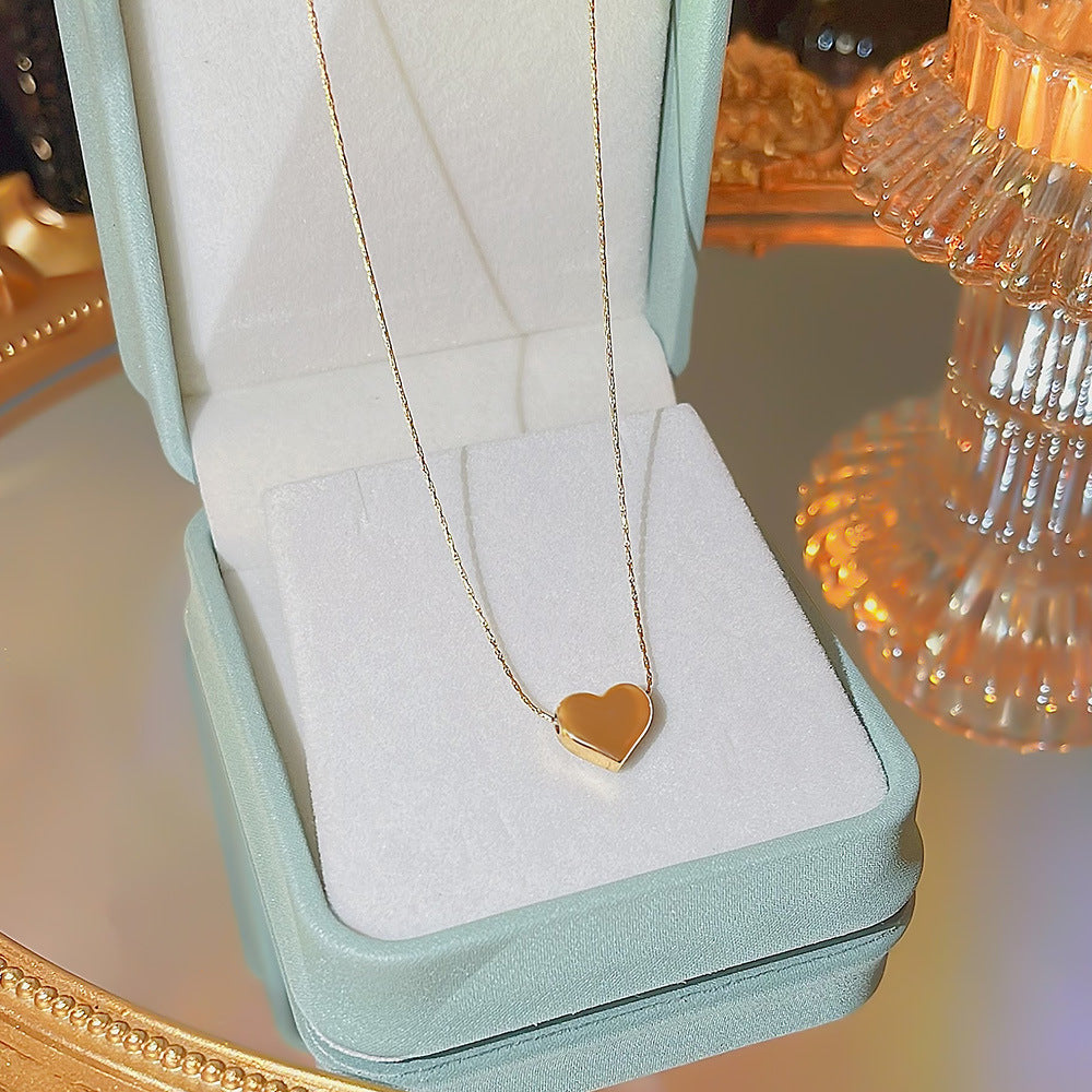 "Golden Love Sweater Chain – Light Luxury Heart Pendant Necklace with Minimalist Design"